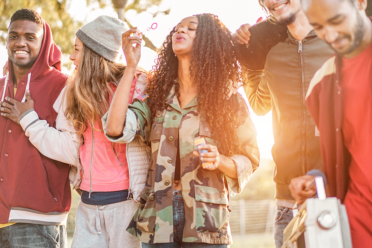 group of teens blowing bubbles